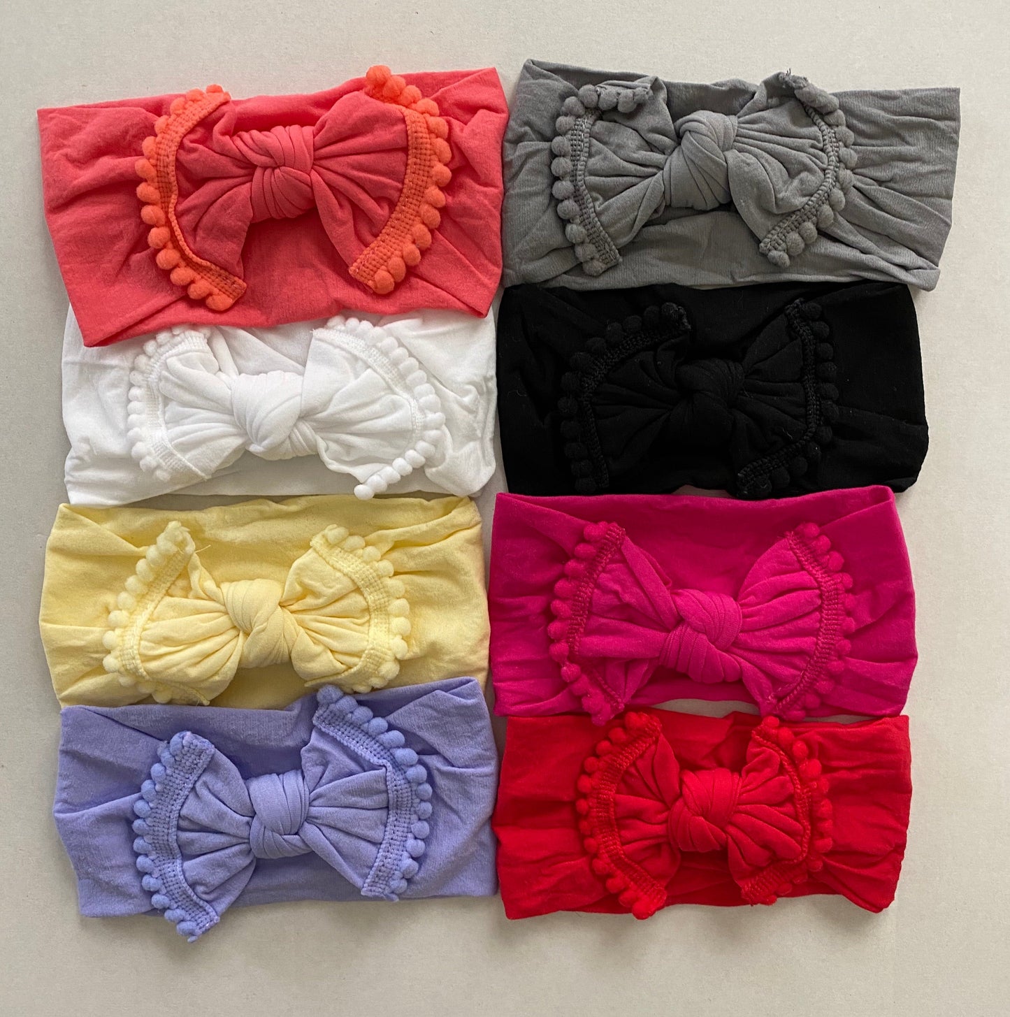 Nylon Headband with pom pom trim bow