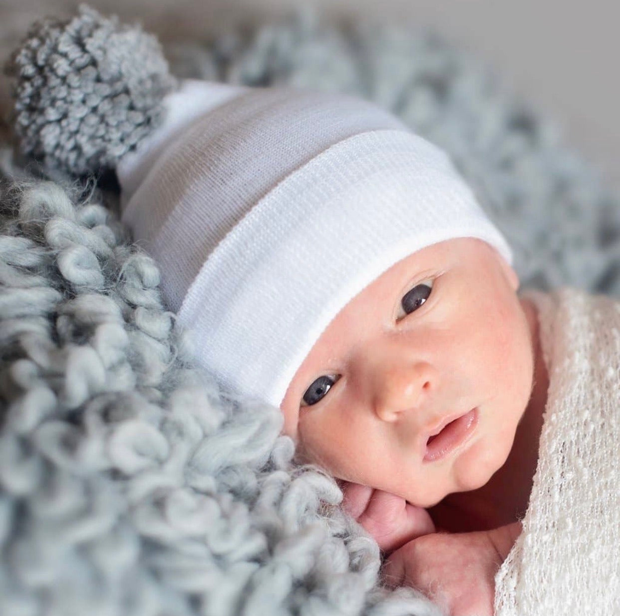 White newborn hospital hat with gray pom