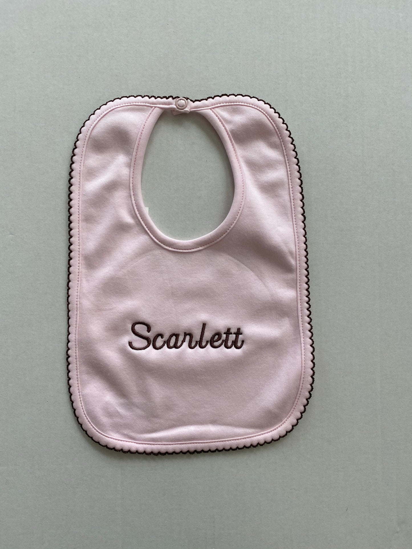 Pink pima cotton bib with chocolate trim