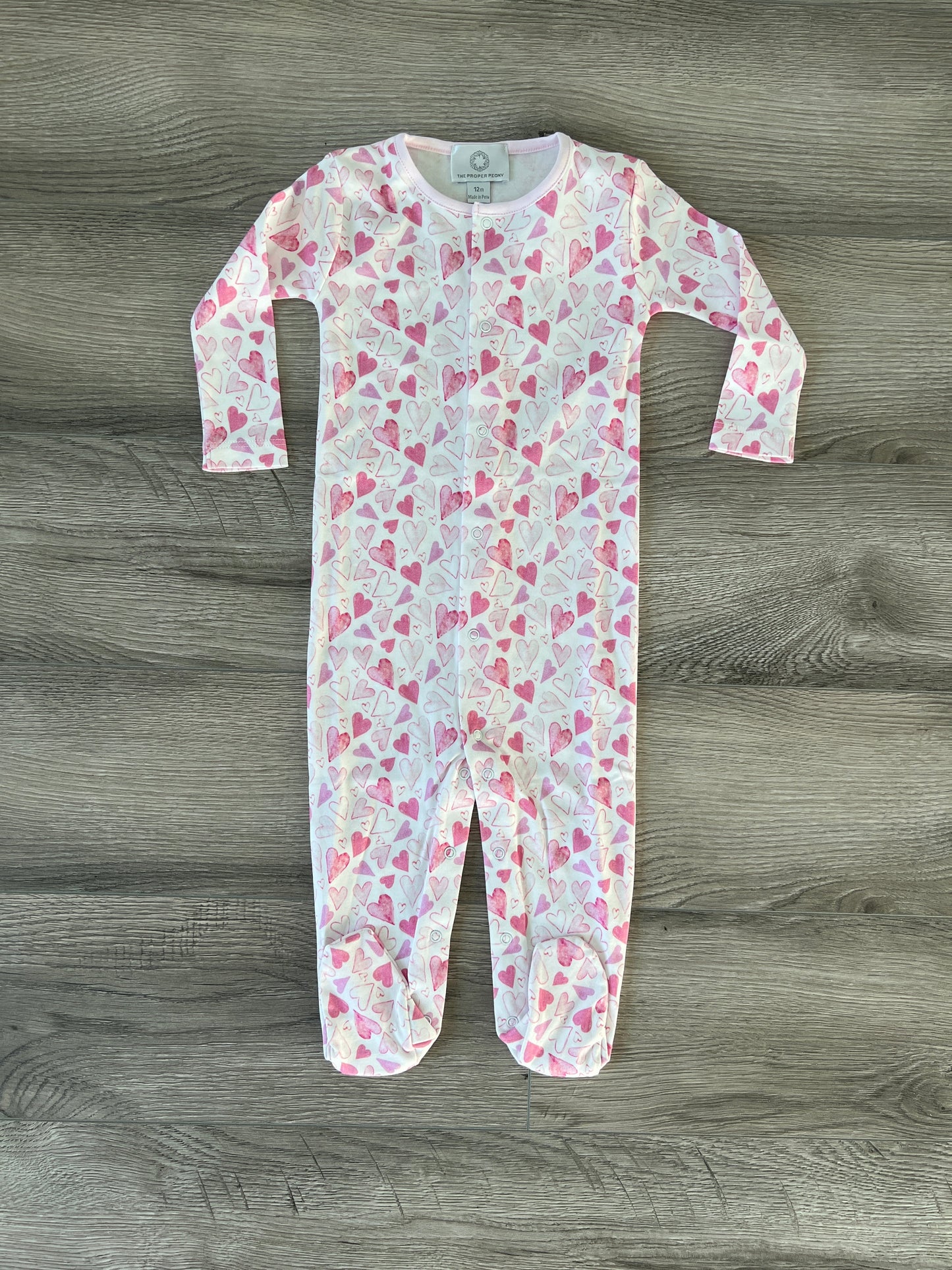 Hearts Footed Romper by the Proper Peony