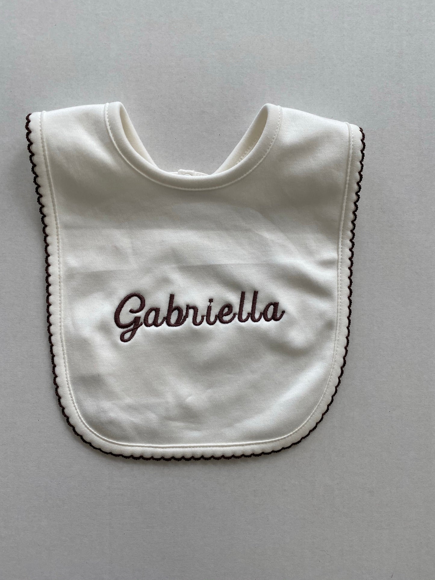 Cream pima cotton bib with chocolate trim