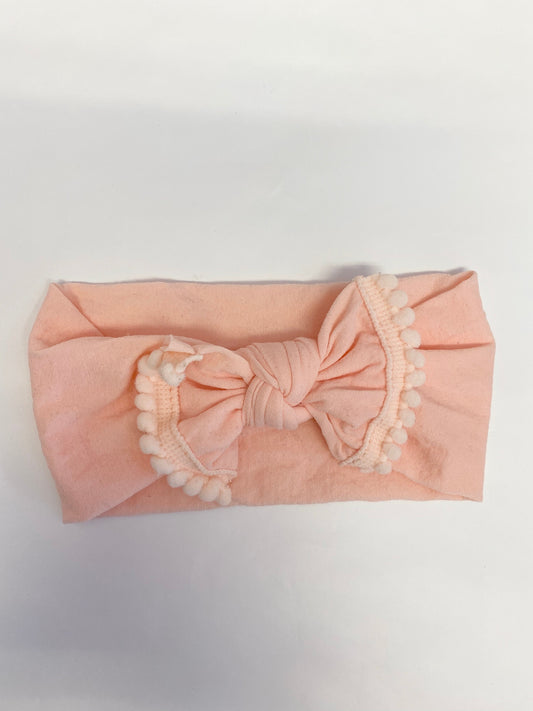 Peach nylon headband with pom pom bow